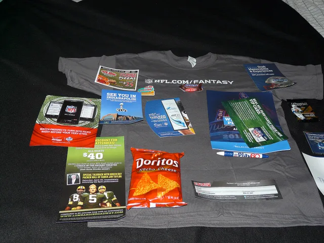 From a tee-shirt to a Snickers bar, a Play 60 pen, a bag of Doritos, assorted coupons for play tickets ("Lombardi"), Verizon phones, Papa John's Pizza (and a magnet!), football cards, draft guide. Promotional products: what BPMA membership means