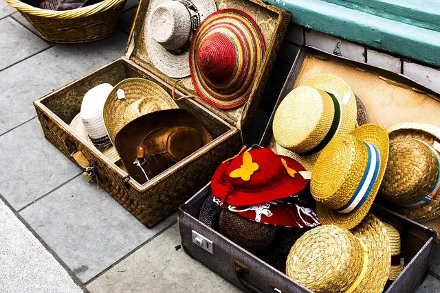 hats, display, suitcase, merchandise, sale, straw hats, sidewalk, outdoor, variety, selection, products, collection, selling, suitcase, suitcase, merchandise, merchandise, merchandise, merchandise, merchandise, variety, selection, selection, selling, selling, selling, selling. Promotional merchandise strategy framework: score items by cost per contact